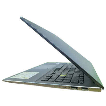 Slim Asus VivoBook S15 S533EA laptop with keyboard and ports visible.