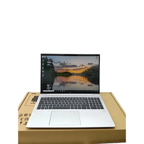 HP EliteBook 865 G9 laptop with a scenic desktop wallpaper.